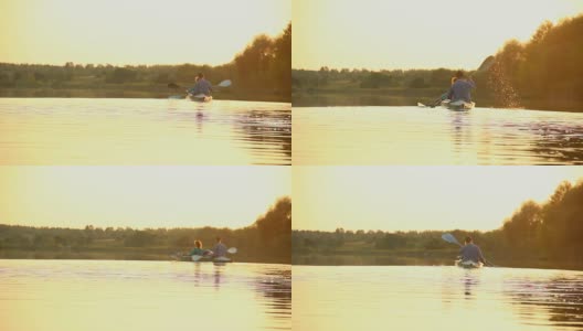 活跃的夫妇在日落皮划艇。健康的生活方式，运动高清在线视频素材下载
