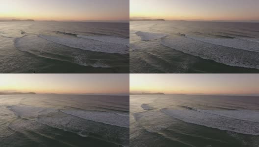 冲浪者在日落的海洋鸟瞰高清在线视频素材下载