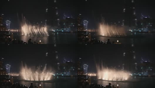 夜城，全景-迪拜舞蹈喷泉。人们观看这个节目。高清在线视频素材下载