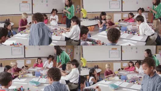 老师和孩子们在课堂上使用积木，用R3D拍摄高清在线视频素材下载