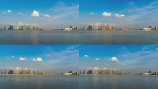 现代城市近河的城市景观在蓝天中时光流逝高清在线视频素材下载