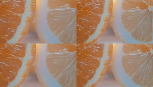 切柑橘，柠檬和橙子近距离观看近在一个白色的背景高清在线视频素材下载