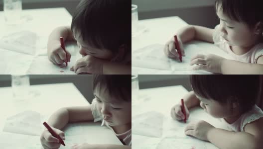 小女儿正在用彩色铅笔画画高清在线视频素材下载