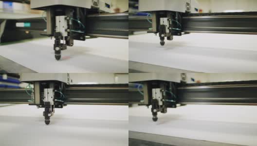 数控织物切割机在室内制造设施中切割织物高清在线视频素材下载