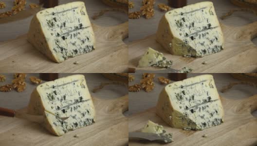 切一块传统的法国蓝奥弗涅奶酪高清在线视频素材下载