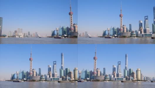 美丽的上海城市景观，蓝天背景，黄浦江上的货船，4k慢镜头，宽镜头b卷拍摄视频。高清在线视频素材下载