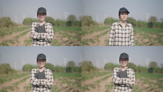 亚洲农民双臂交叉站在麦田里的肖像高清在线视频素材下载
