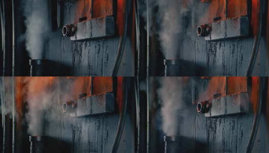 在肮脏的工业环境中，管道爆破蒸汽高清在线视频素材下载