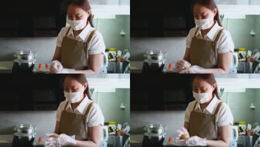 亚洲妇女在厨房制作月饼面团高清在线视频素材下载