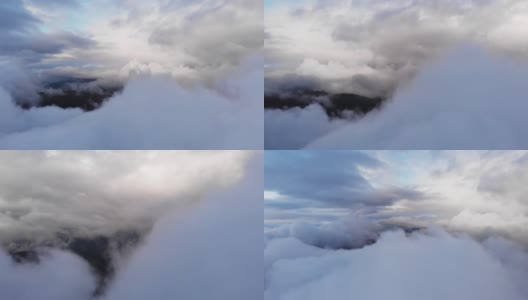 令人惊叹的航拍:无人机飞越毛绒绒的蓝白云。高清在线视频素材下载