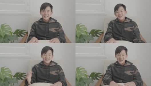 亚洲十多岁男孩的肖像POV在家里视频通话，使用摄像头放大在线虚拟课堂，社交距离，家庭教育，远程学习，新常态的概念高清在线视频素材下载