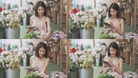 微笑年轻的花店女商人在花店制作和工作装饰和安排鲜花订单和鲜花交付。小企业主高清在线视频素材下载