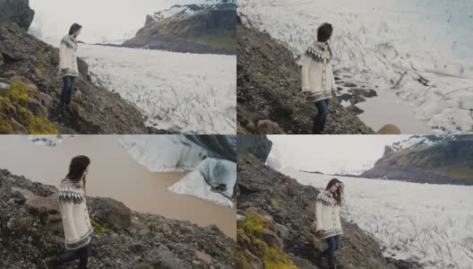 一名年轻的旅行女子在山上的岩石中行走，探索冰岛的Vatnajokull冰川湖高清在线视频素材下载