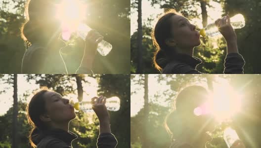 一个漂亮的年轻女人在夏天的一天在公园里锻炼喝水高清在线视频素材下载