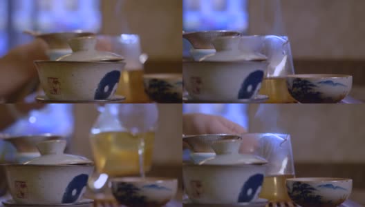 师傅从白碗中倒茶。中国茶道高清在线视频素材下载
