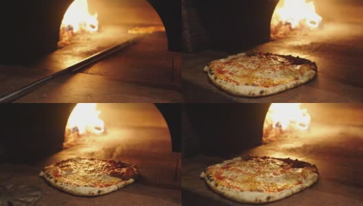 披萨师傅把带皮的那不勒斯披萨从烤箱里拿出来高清在线视频素材下载