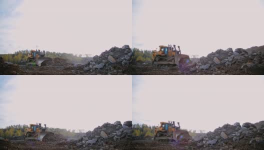 广角全景推土机移动石头和泥土高清在线视频素材下载