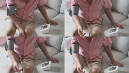 亚洲华人老年男子正在监测血压高清在线视频素材下载