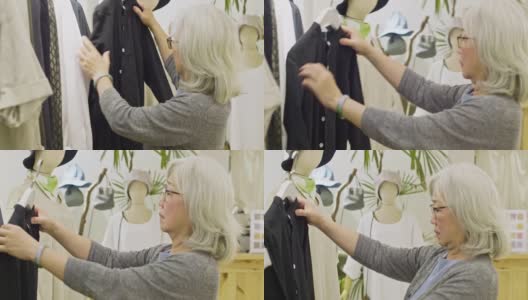 退休中国妇女在服装店购物高清在线视频素材下载