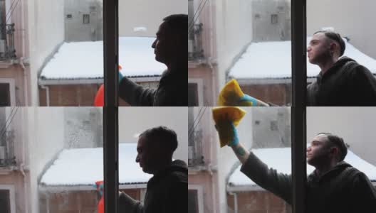 一个男人清洗和擦窗户高清在线视频素材下载