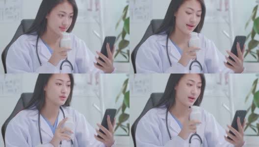 慢动作亚洲女医生通过视频聊天在线咨询患者关于症状和药物高清在线视频素材下载