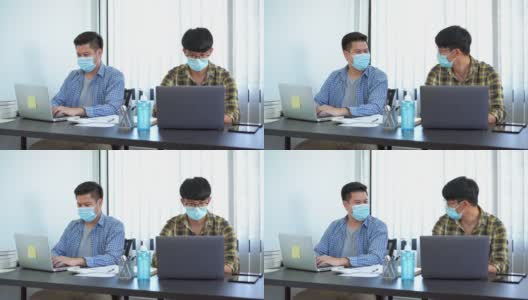 两名工友戴口罩打招呼用肘打招呼避免握手的4k视频，以确保新冠肺炎疫情期间的安全和防护高清在线视频素材下载
