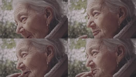 老奶奶盯着远方，奶奶，近距离拍肖像。高清在线视频素材下载