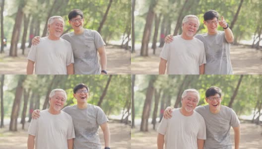 夏日清晨，4K亚洲老人和成年儿子一起在海滩上做运动。高清在线视频素材下载