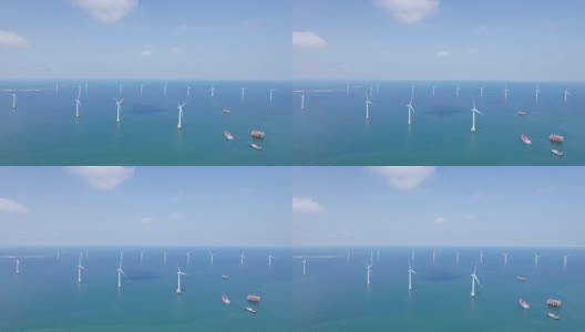 在阳光明媚的日子鸟瞰壮丽的海上风力发电厂高清在线视频素材下载