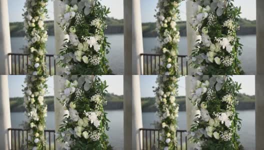 优雅的婚礼拱门，鲜花，河流背景上的花瓶高清在线视频素材下载