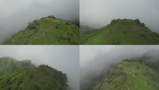 在雾天由无人机的绿色雨林山的鸟瞰图高清在线视频素材下载