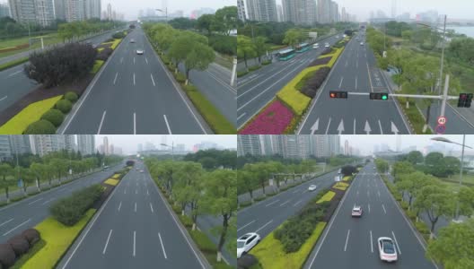 鸟瞰图的汽车运行在城市道路上的日落，中国。高清在线视频素材下载