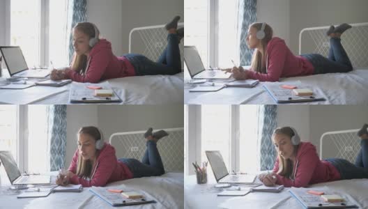 在covid-19隔离期间，一个认真的女人在家里用笔记本电脑工作高清在线视频素材下载