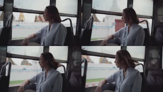 美女在公交车上欣赏风景高清在线视频素材下载