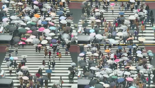 日本东京新宿商业区，日本人挤在新宿JR车站大楼之间的街道上的4K镜头。高清在线视频素材下载