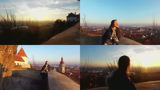 4 k。美丽的女孩看全景从城堡在斯洛文尼亚的老城普图伊。日落时间-编辑高清在线视频素材下载