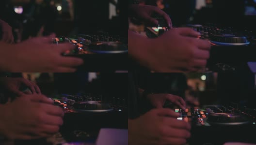 近距离的DJ手混合的轨道在夜总会在派对的舞台上高清在线视频素材下载