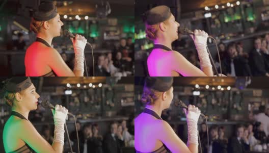美丽的女爵士歌手在餐厅表演歌曲，庆祝活动高清在线视频素材下载