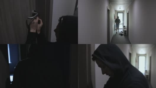 小偷沿着走廊偷东西，并打破了公寓的门高清在线视频素材下载