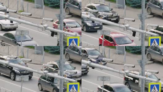 在这个大城市的道路上四个交通安全监控摄像头的特写高清在线视频素材下载