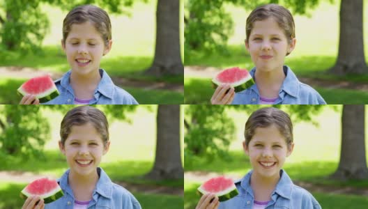可爱的小女孩在公园里吃西瓜高清在线视频素材下载