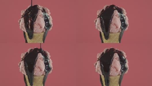 旋转草莓冰淇淋在蛋筒与巧克力酱高清在线视频素材下载