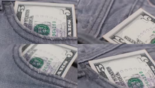 5美元钞票放在牛仔裤口袋里的转盘上。极端的特写，浅景深。经营理念。高清在线视频素材下载