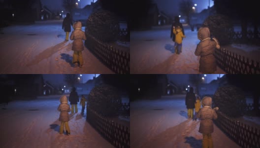 孩子们晚上在外面玩雪高清在线视频素材下载