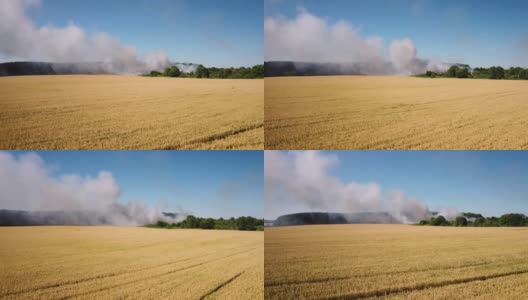 无人机拍摄到在农田附近焚烧垃圾的画面高清在线视频素材下载