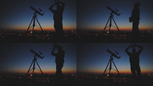 一个人的剪影，望远镜和星空下的乡村。高清在线视频素材下载