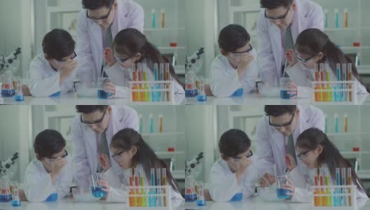 科学家教学生在实验室学习和做科学实验高清在线视频素材下载