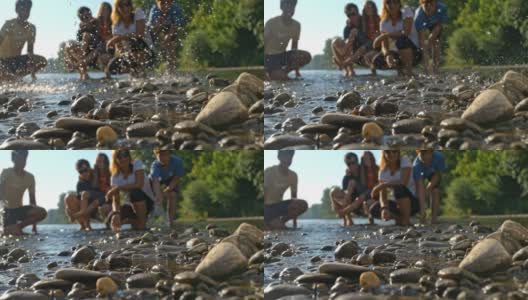 SUPER SLOW MO家族向相机方向喷水。看着青蛙跳。高清在线视频素材下载