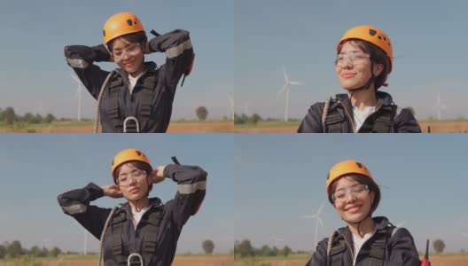 在风力发电厂穿着防护服的亚洲女工程师高清在线视频素材下载