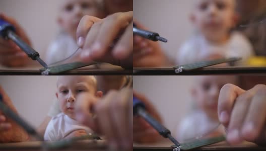 父亲教儿子如何焊接电缆高清在线视频素材下载